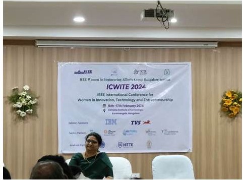 Adapa Chathurya at IEEE ICWITE 2024, Bangalore — IBM-sponsored conference banner behind her